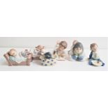 SIX NAO PORCELAIN FIGURES including a boy with his dog and reading a book, 18cm long, boy with a