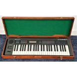 ROLAND JUNO-1 ELECTRONIC SYNTHESIZER serial number 603476, in a wooden baize lined case