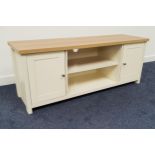 OAK EFFECT LOW SIDE CABINET with a rectangular top above two central shelves flanked by a pair of