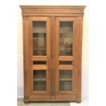EARLY 19th CENTURY FRENCH PROVINCIAL OAK ARMOIRE with a moulded pediment above a pair of panelled