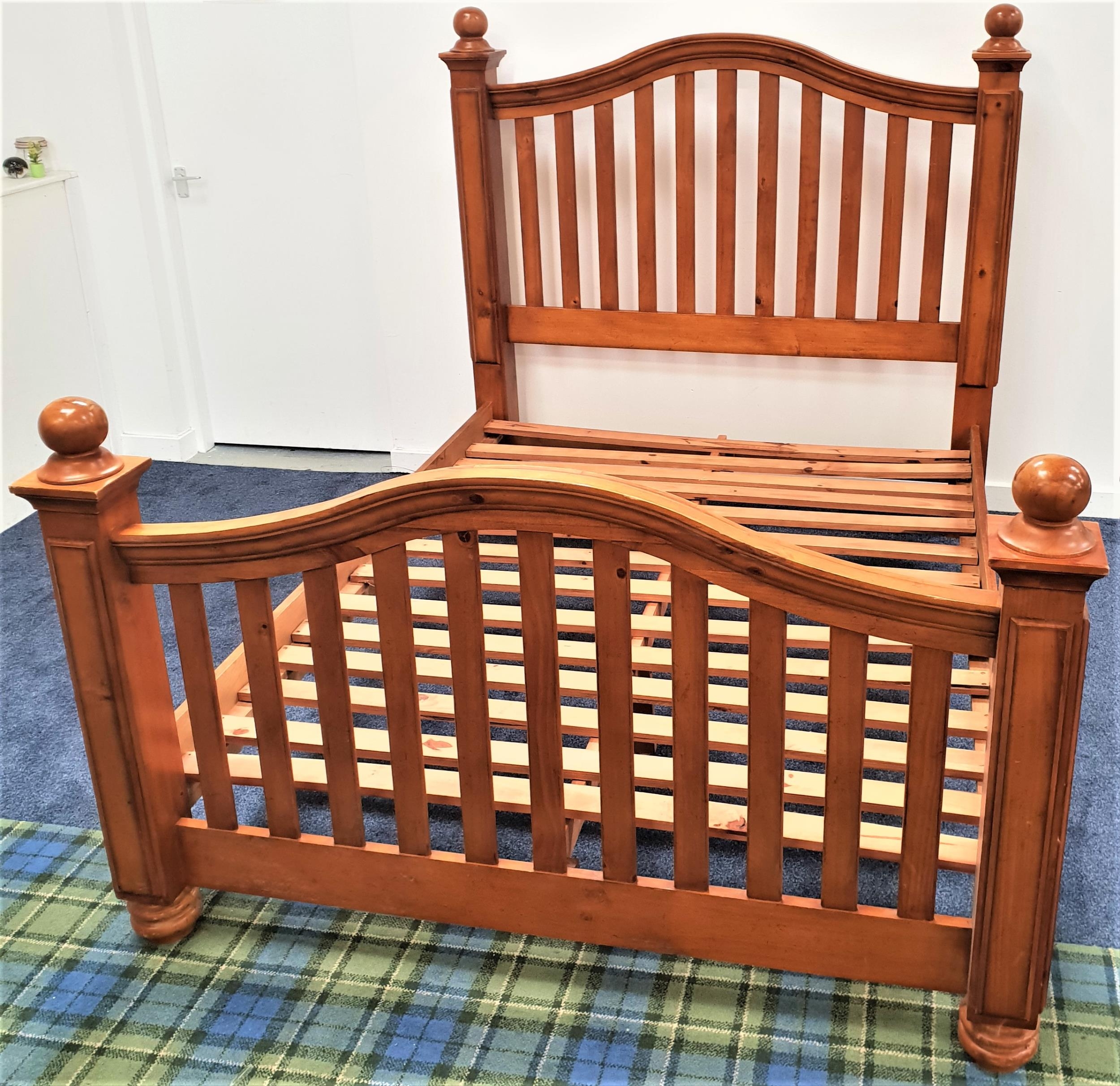 VIETNAMESE TEAK KING SIZE BED with an arched slatted head and footboard, plank sides and a slatted