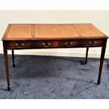 GEORGE III MAHOGANY WRITING DESK with three inset tooled leather panels above three cockbeaded