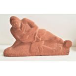 A.R.CAMERON chip carved red sandstone figure of a footballer sliding for the ball, monogrammed and