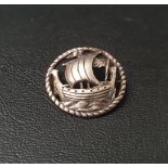 ALEXANDER RITCHIE IONA SILVER BROOCH the pierced circular brooch depicting a Viking ship within rope