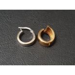 TWO SINGLE FOURTEEN CARAT GOLD HOOP EARRINGS one in white gold and the other in yellow gold, total