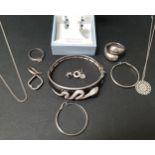SELECTION OF SILVER JEWELLERY comprising a crystal snake decorated bangle, a CZ ring, another