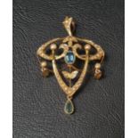 EDWARDIAN AQUAMARINE AND SEED PEARL HOLBEIN BROOCH/PENDANT the central oval cut aquamarine in seed