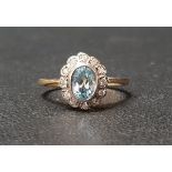 BLUE TOPAZ AND DIAMOND CLUSTER RING the central oval cut topaz approximately 0.75cts in twelve