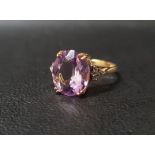 AMETHYST AND DIAMOND DRESS RING the central oval cut amethyst measuring 12.1mm x 10mm x 5.6mm,