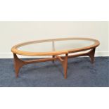 RETRO STATEROOM BY STONEHILL TEAK OCCASIONAL TABLE with an inset oval glass top, standing on