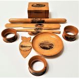 SELEECTION OF MAUCHLINE WARE including a letter opener, pin dish of Dalbeattie, three napkin rings