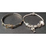 TWO FASHION BRACELETS comprising a Pandora silver charm bracelet with four charms and two clips; and