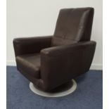 LEATHER SWIVEL ARMCHAIR in brown leather with a deep padded back, seat and arms, on a circular