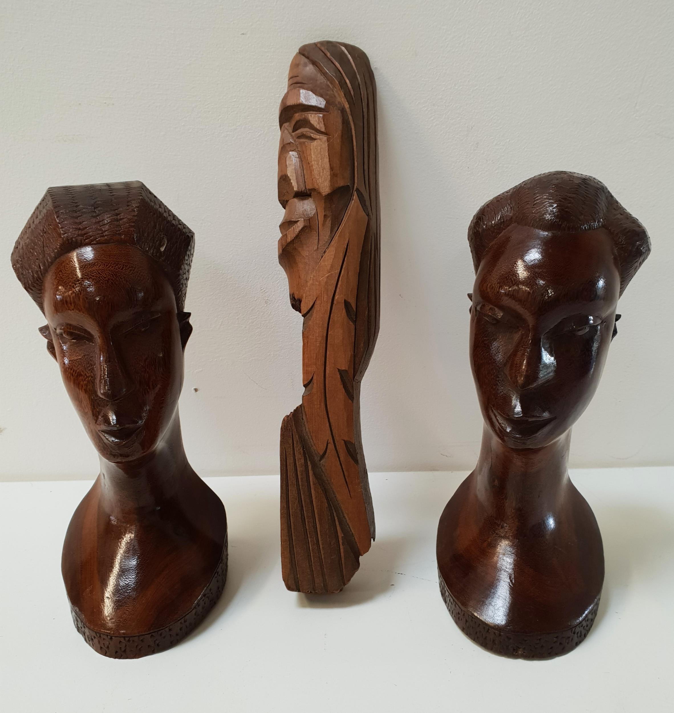 PAIR OF CARVED AFRICAN HEADS of a man and a woman, 21cm high and a carved softwood Polynesian head