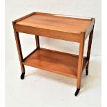 TEAK TEA TROLLEY with a rectangular top above two two pull out shelves above a lower shelf, on