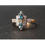 UNUSUAL BLUE TOPAZ AND DIAMOND CLUSTER RING the two oval cut topaz gemstones totalling approximately