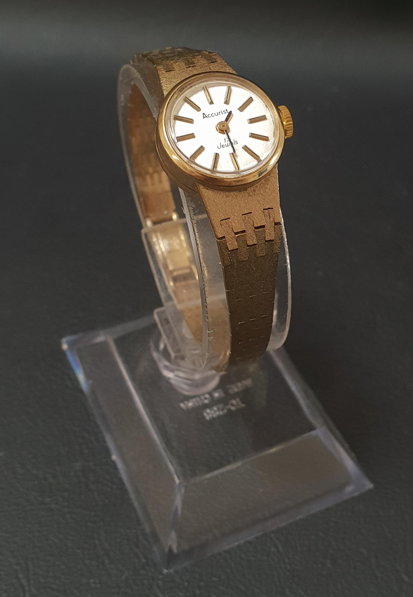 LADIES NINE CARAT GOLD ACCURIST WRISTWATCH the circular dial with baton five minute markers and 17