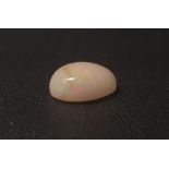 CERTIFIED LOOSE NATURAL OPAL the oval cabochon cut opal weighing 5.82cts, with IDT Gemmological