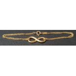 TIFFANY & CO. EIGHTEEN CARAT GOLD INFINITY BRACELET the double chain bracelet with central