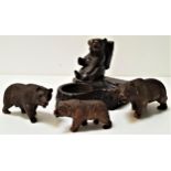 BLACK FOREST CARVED SMOKING COMPANION depicting a seated bear with a basket on his back, possibly