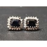PAIR OF SAPPHIRE AND DIAMOND CLUSTER STUD EARRINGS the central rectangular step cut sapphire on each