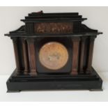 EDWARDIAN BLACK SLATE MANTLE CLOCK with a circular brass dial with Arabic numerals and an eight