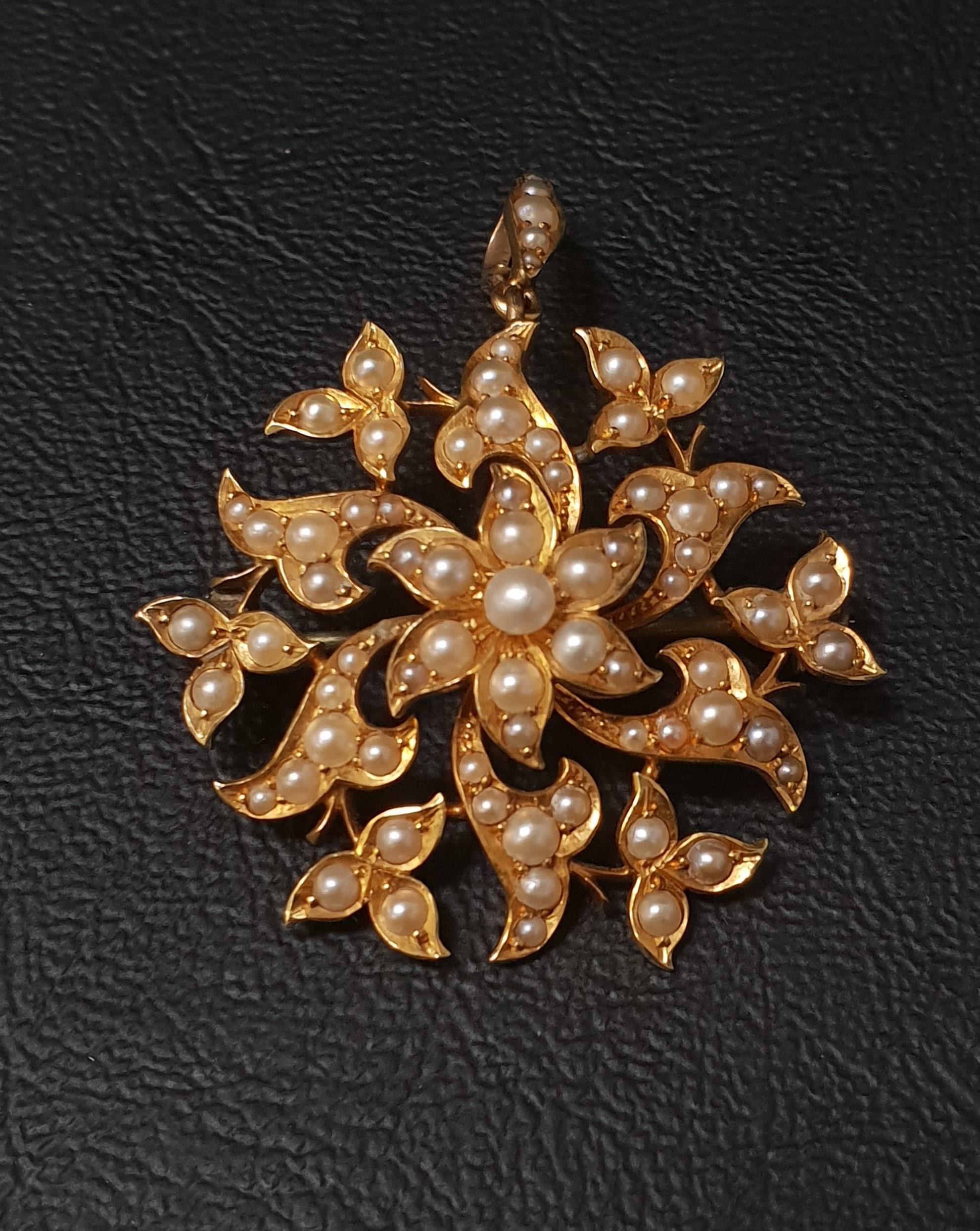 EDWARDIAN SEED PEARL SET BROOCH/PENDANT in fifteen carat gold, 3.6cm wide