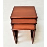 G PLAN QUADRILLE NEST OF TABLES in teak, with shaped supports, 52cm high