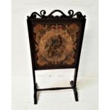 VICTORIAN ROSEWOOD FIRESCREEN with an embroidered panel depicting a central raised bird encased by a