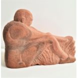 A.R.CAMERON chip carved red sandstone figure of a seated man, monogrammed and dated ARC '91, 42cm