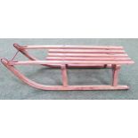 CHILDRENS VINTAGE WOODEN SLEDGE with a slatted body and shaped runners