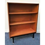 TEAK BOOKCASE with an open shelf above a lower adjustable shelf, standing on tapering supports, 97.