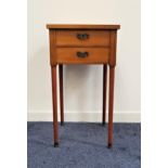MAHOGANY SIDE TABLE with a square top above two drawers, standing on turned tapering supports with