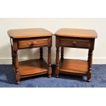 PAIR OF ERCOL STYLE DARK ELM BEDSIDE TABLES with moulded tops above a panelled frieze drawer with