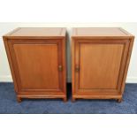 PAIR OF CHINESE TEAK CABINETS each with a panelled door opening to reveal one with three deep