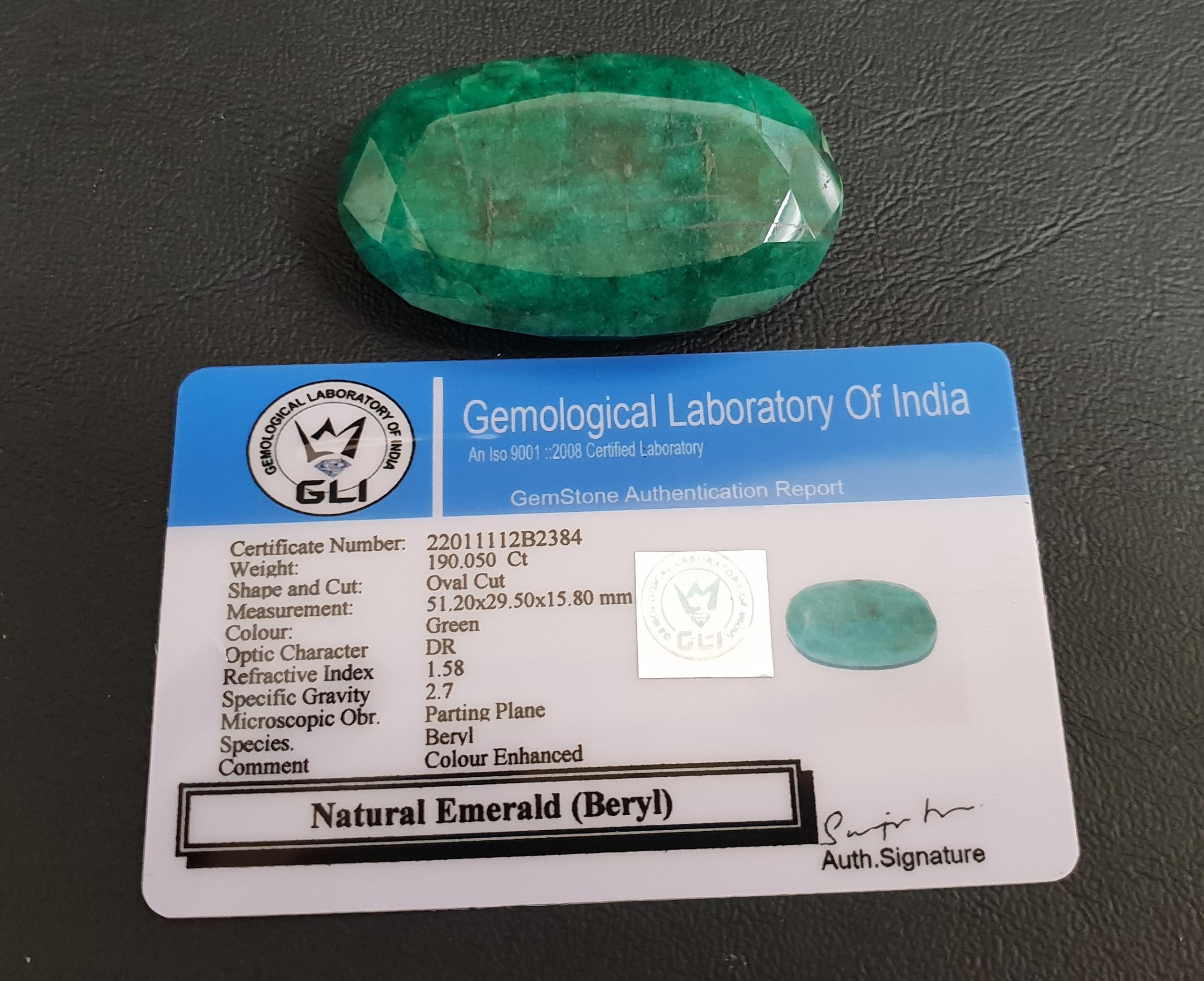 CERTIFIED LOOSE NATURAL EMERALD the oval cut emerald weighing 190.05cts, with GLI Gemmological