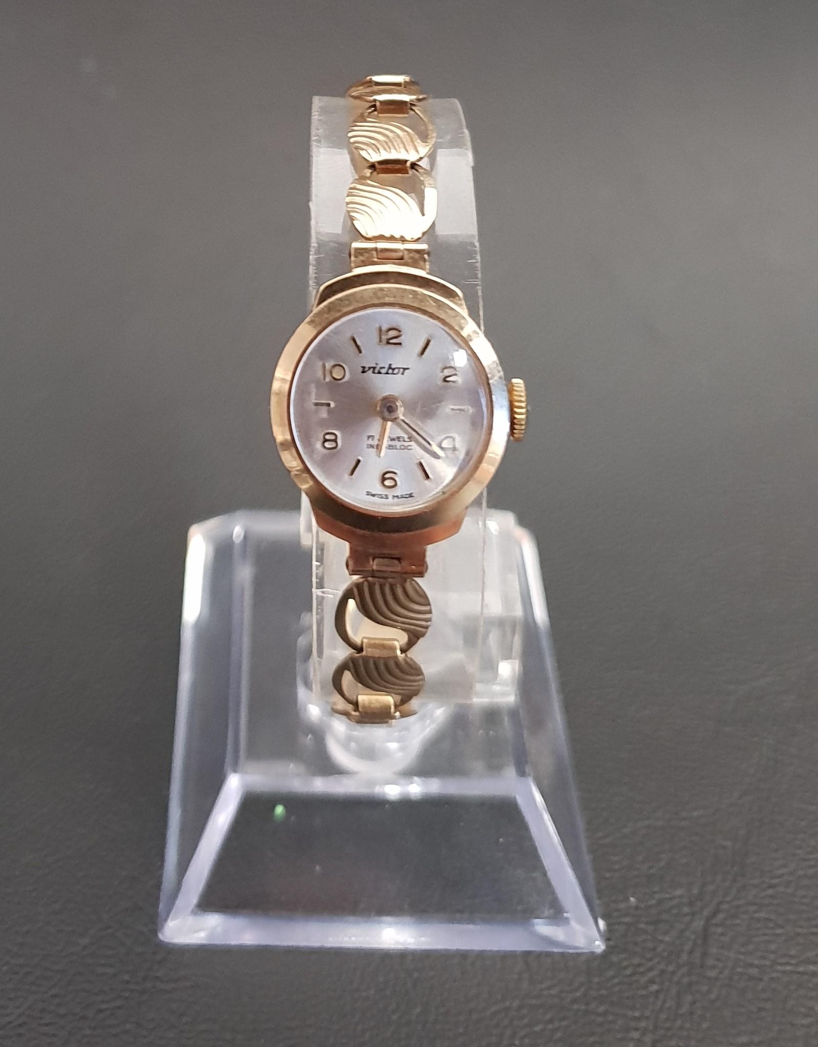 LADIES NINE CARAT GOLD CASED VICTOR WRISTWATCH the circular silvered dial with alternating Arabic