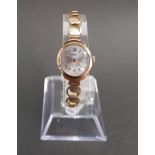LADIES NINE CARAT GOLD CASED VICTOR WRISTWATCH the circular silvered dial with alternating Arabic