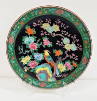 JAPANESE FAMILLE NOIR CHARGER with a green floral border and centred with a pheasant, with character