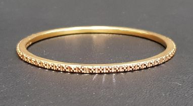 TWENTY-ONE CARAT GOLD BANGLE with relief ball detail, approximately 7.8 grams