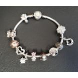 PANDORA MOMENTS SILVER CHARM BRACELET with logo sparkle clasp, four Pandora charms and two clips;