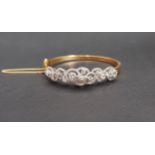 IMPRESSIVE DIAMOND SET TWENTY-ONE CARAT GOLD BANGLE the multi diamonds in pierced and scrolling