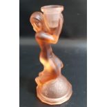 LALIQUE STYLE CANDLESTICK in orange glass depicting a woman kneeling on a dome clasping the