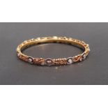 TWENTY-ONE CARAT GOLD BANGLE the relief moulded bangle set with clear paste stones, approximately