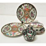 SELECTION OF FAMILLE ROSE including a tea bowl, 9.5cm diameter, two plates, 22cm diameter and a