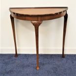 H. SHAW OF LONDON WALNUT SIDE TABLE the D shaped top with a wavy rim standing on slender cabriole
