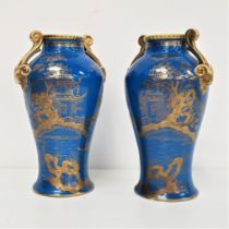 PAIR OF NORITAKE BALUSTER VASES with a cobalt blue ground and gilt scroll handles, decorated with