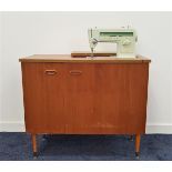 SINGER SEWING MACHINE model 527, in a two door teak cabinet with fold away action, the other