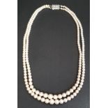 GRADUATED DOUBLE STRAND PEARL NECKLACE with diamond set nine carat white gold clasp, approximately