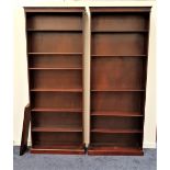 PAIR OF LARGE MAHOGANY BOOKCASES with a moulded top and dentil cornice, each with six shelves,